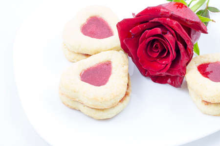 Valentine's Day Heart Cookies with red roseの写真素材