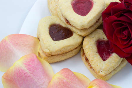 Valentine's Day Heart Cookies with red roseの写真素材