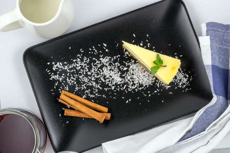 White chocolate cheesecake with mint and cinnamonの写真素材