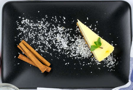 White chocolate cheesecake with mint and cinnamonの写真素材