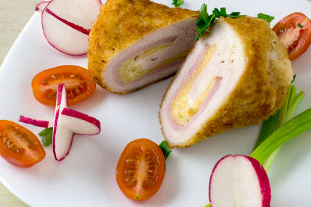 Chicken cordon bleu with vegetablesの写真素材