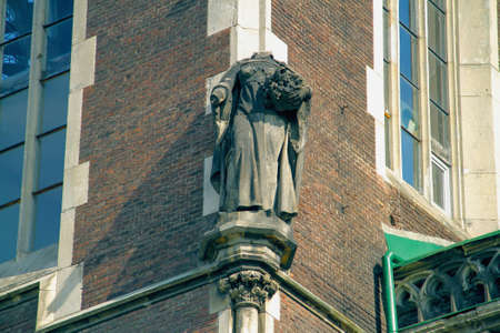Headless sculpture on the corner of the buildingの写真素材