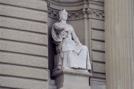 Knight Sculpture with a sword sitting on the throneの写真素材