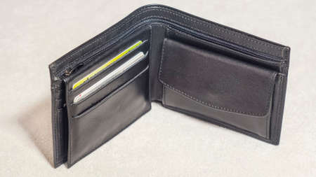 Open black leather wallet with credit cardsの写真素材