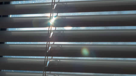 Sun nice shining through the blindsの写真素材