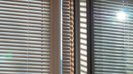 Sun is shining and glowing through the blinds