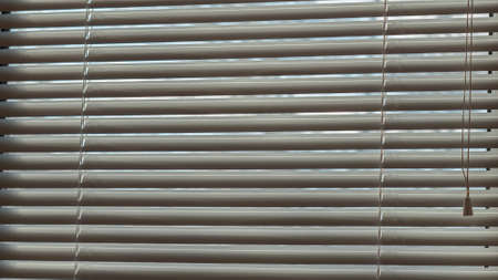 Closed blinds on the sunny dayの写真素材