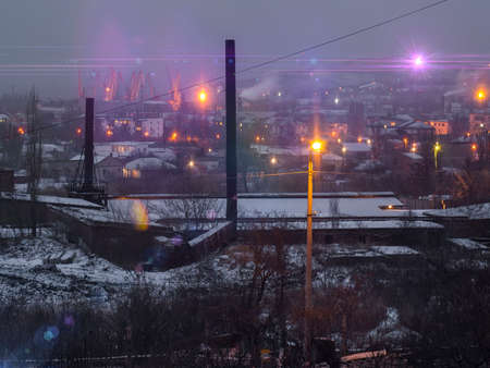 The view of the plant and the city nightlifeの写真素材