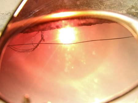 Reflections of a bright summer sun on the glassesの写真素材