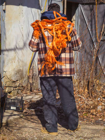 the bright orange rope on a person back