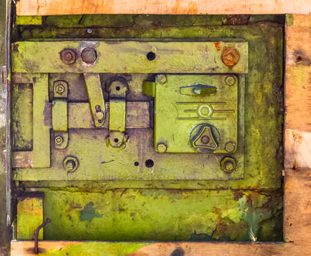 Closeup of old lock on metal garage doorの写真素材