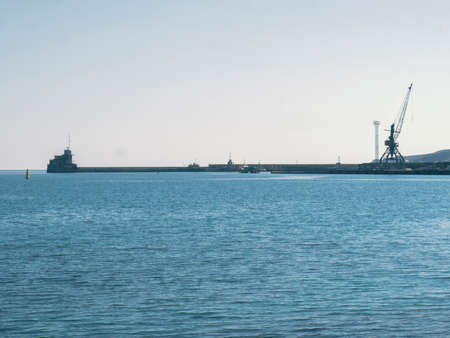The pier and port cranes on the sea backgroundの写真素材