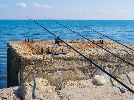 The fishing rods on the beach in the morning