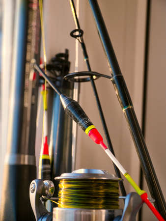 The float, fishing rod and fishing reel close-upの写真素材
