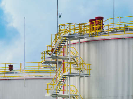 Large oil tanks against the blue skyの写真素材