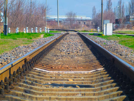 The rails of the railroad go into the distance