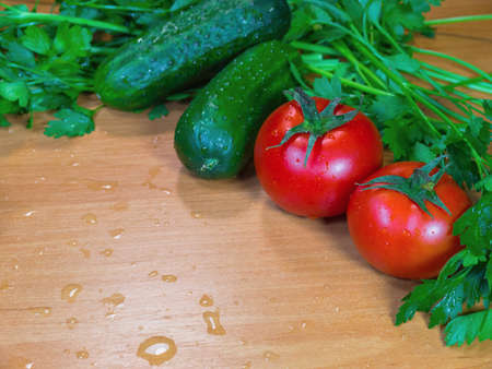 The fresh vegetables on the wooden wet tableの写真素材