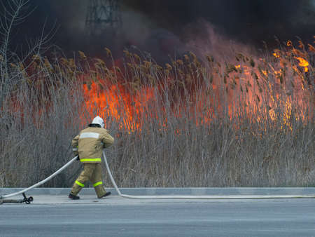 The fireman is in a hurry to put out the fireの写真素材