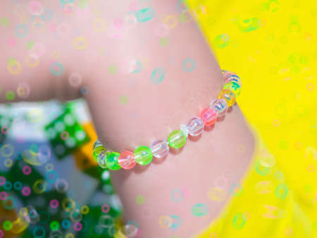 The beautiful necklace on the girl's handの写真素材