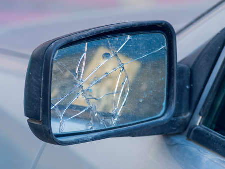 The broken rear view mirror in the carの写真素材