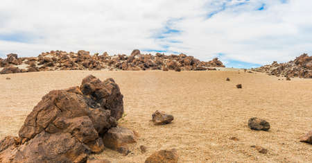 Rocks and sand and skyの写真素材
