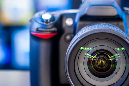 Digital camera lying on the table in the store.の写真素材