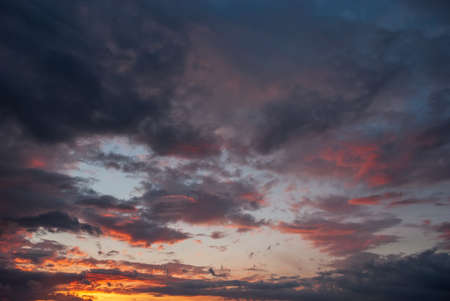 Beautiful sunset sky with thunderstorm cloudsの写真素材