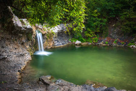 Autumn landscape. Cascades of small waterfalls of the mountain river. Jane River. Krasnodar...