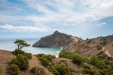 Crimean peninsula. Mountain Dragon against the backdrop of the Black Sea and a beautiful sky.の写真素材