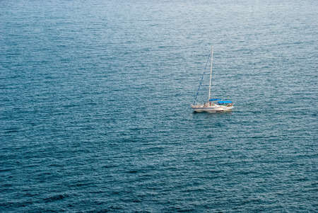 The yacht is isolated against the backdrop of the Black Sea waves.の写真素材