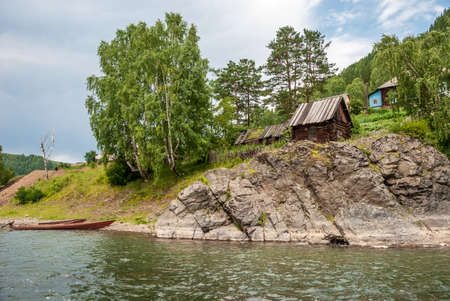 Landscapes of Siberia. Small settlements in mountainous places on the Kiya River. Kemerovo region. Russia.の写真素材