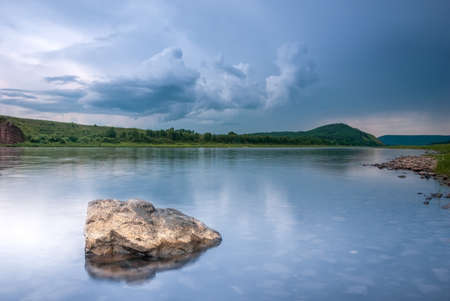 Landscapes of Siberia. Evening landscape on the Kiya river. Mountains, forest, river and water at long exposure. Kemerovo region. Russiaの写真素材