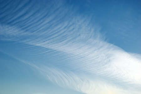 Heap white clouds in a clear blue sky.