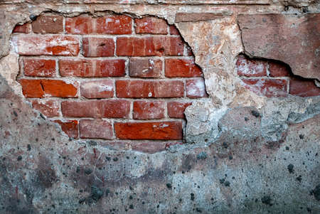 Old brick wall with plaster peeling, grunge background