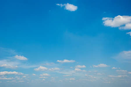 Blue sky background with tiny clouds.の写真素材
