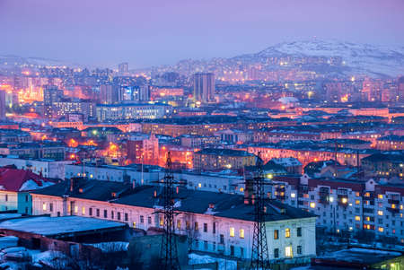 Murmansk city in winter is the northern port city. The largest behind the Arctic Circle. Evening city against the backdrop of sunset skies.の写真素材