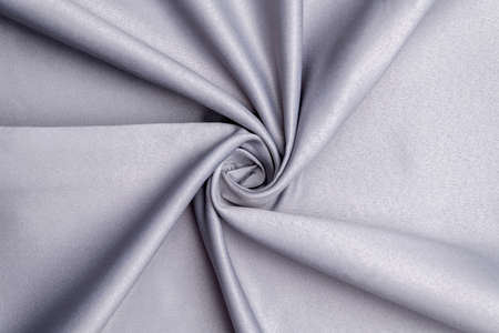 Background, texture. Template. Satin cloth for wedding and evening dresses. A nude shade.の写真素材