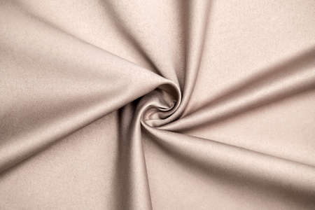 Background, texture. Template. Satin cloth for wedding and evening dresses. A nude shade.の写真素材
