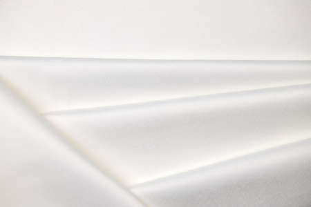 Background, texture. Template. Satin cloth for wedding and evening dresses. A nude shade.の写真素材