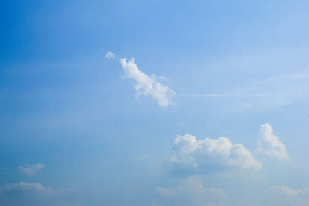 Blue sky background with tiny clouds.の写真素材