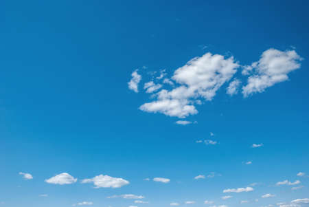Blue sky background with tiny clouds.の写真素材