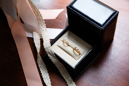 Wedding rings in a black and white jewelry box