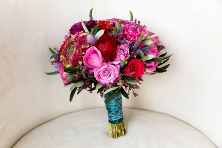 Bouquet of pink and red roses in combination with wildflowersの写真素材