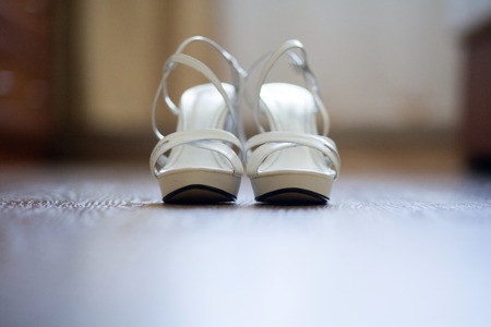 White women's high platform on the floor. Shallow depth of fieldの写真素材