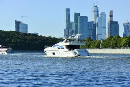 Moscow. Luxury yacht "Archangel Michael" floats on the Moscow River. In the background skyscrapers of Moscow Cityのeditorial素材