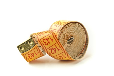 Curled measuring tape isolated on whiteの写真素材