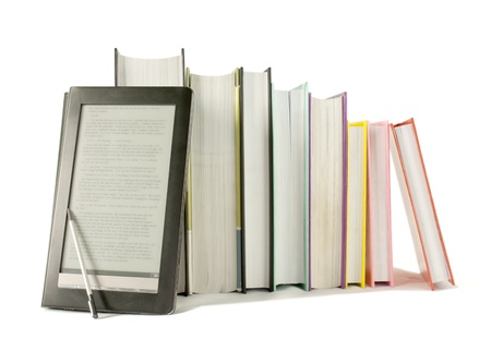 Row of printed books with electronic book reader on white backgroundの写真素材