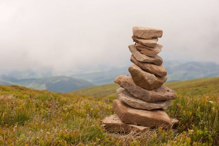 Stack of stones laying in the mountainsの写真素材