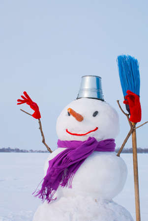 Lonely snowman at a snowy field at winter timeの写真素材