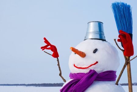 Lonely snowman at a snowy field at winter timeの写真素材